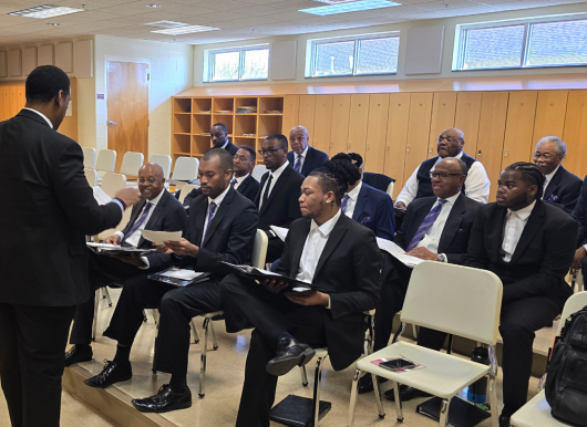 picture of male chorus rehearsing